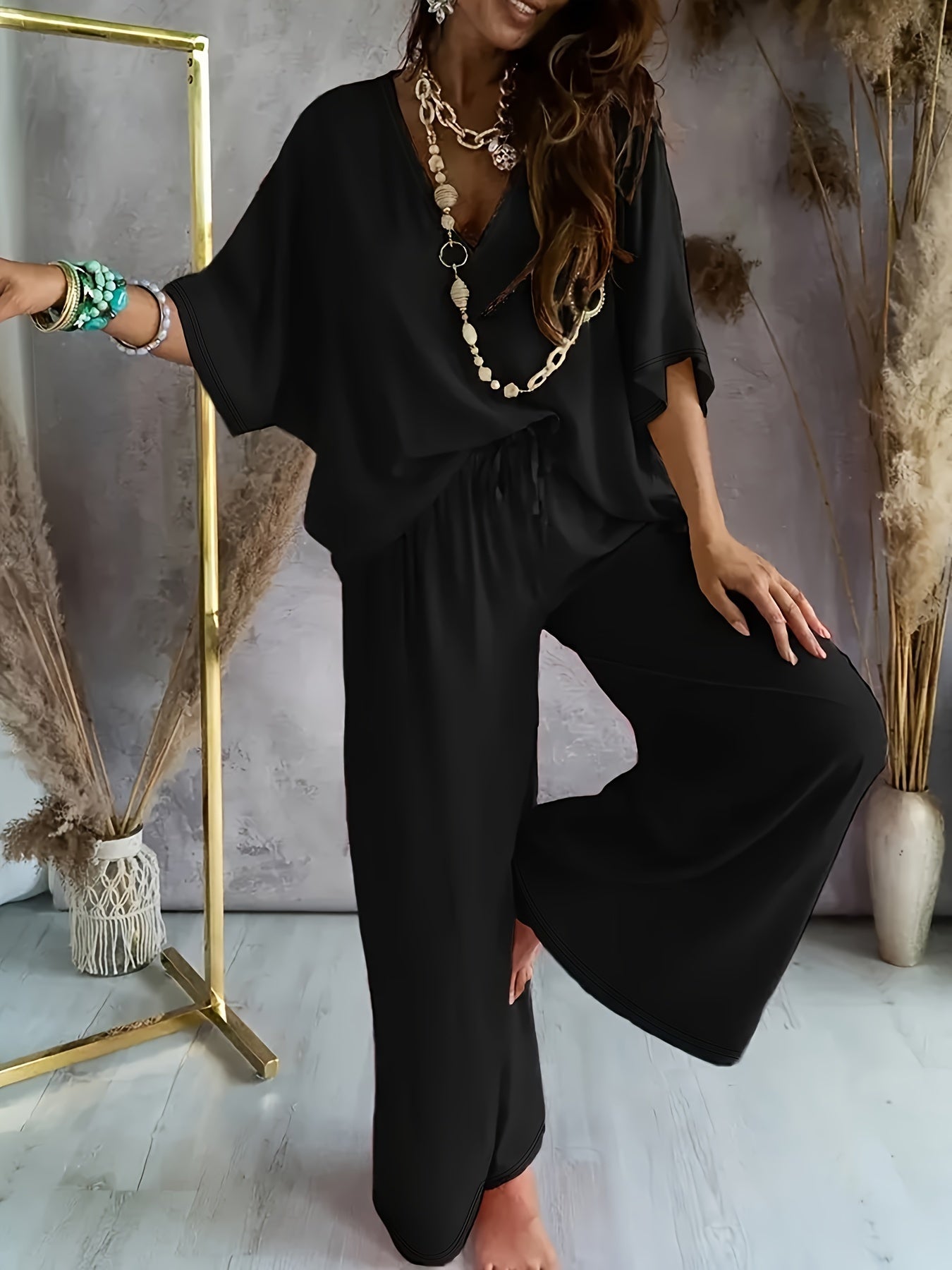 Damen Eleganter Jumpsuit mit weitem Bein und V-Ausschnitt – Perfekt für Freizeit und Partys