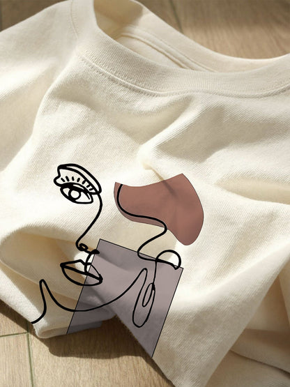 Damen T-Shirt mit abstraktem Gesicht Print – Modernes Kunst Design, Freizeitstil, ideal für Alltag und Streetwear