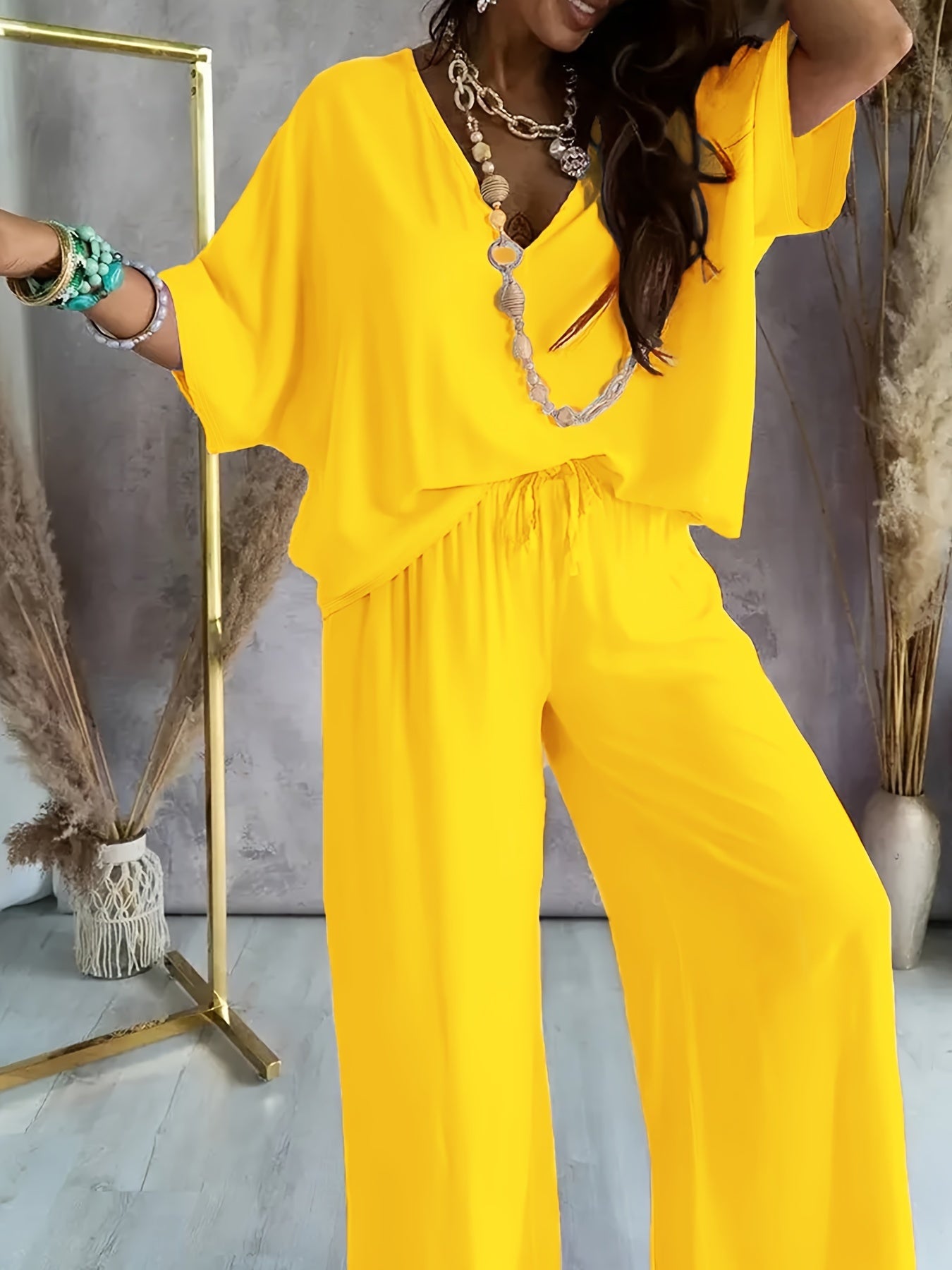 Damen Eleganter Jumpsuit mit weitem Bein und V-Ausschnitt – Perfekt für Freizeit und Partys