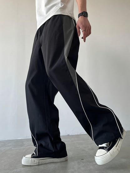 Herren Streetwear Weite Jogginghose mit Kontraststreifen und sportlichem Look