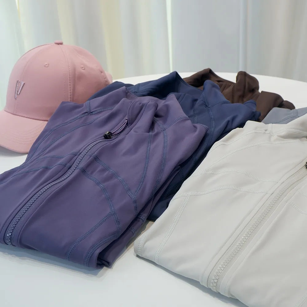 Damen Sportjacke mit Stehkragen, Reißverschluss und Daumenlöchern – Grau