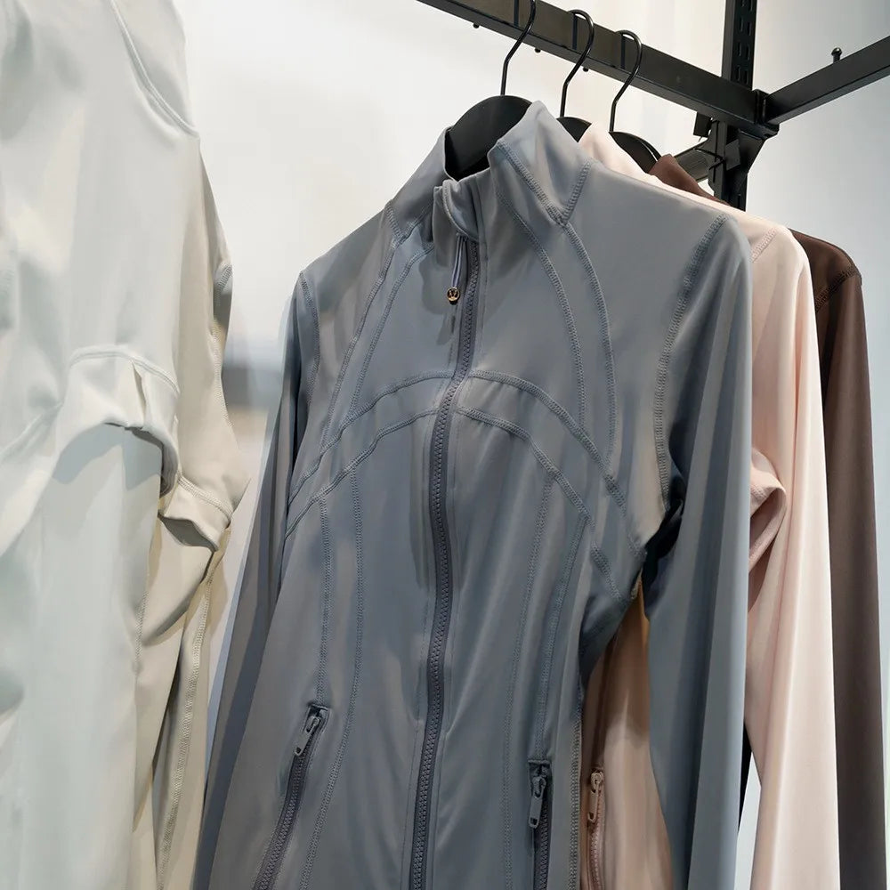 Damen Sportjacke mit Stehkragen, Reißverschluss und Daumenlöchern – Grau