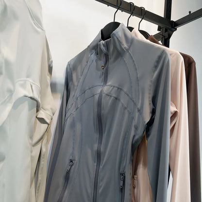 Damen Sportjacke mit Stehkragen, Reißverschluss und Daumenlöchern – Grau