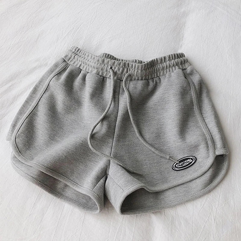 Damen Sportshorts mit Kordelzug und Logo-Patch