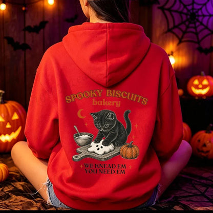 Unisex Hoodie mit „Spooky Biscuits Bakery“ Katze Print und Kängurutasche