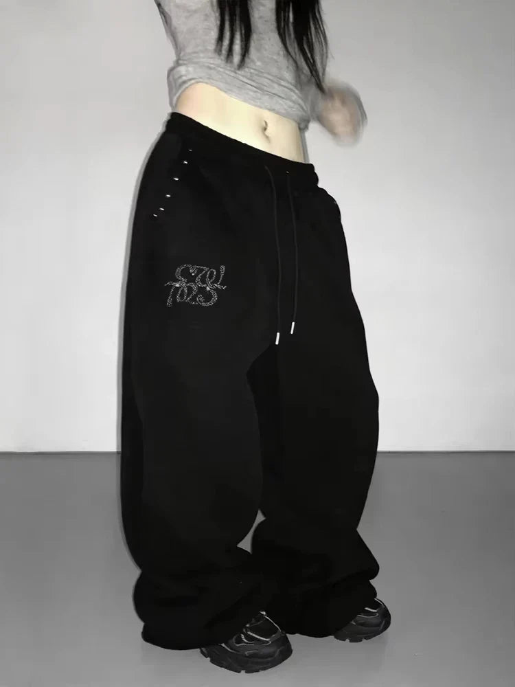 Schwarze weite Freizeithose für Damen mit Strass-Details und Kordelzug