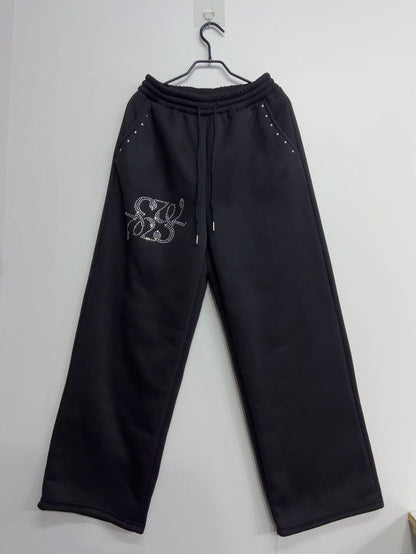 Schwarze weite Freizeithose für Damen mit Strass-Details und Kordelzug