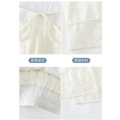 Weiße weite Damenhose mit floraler Stickerei, hoher Bund