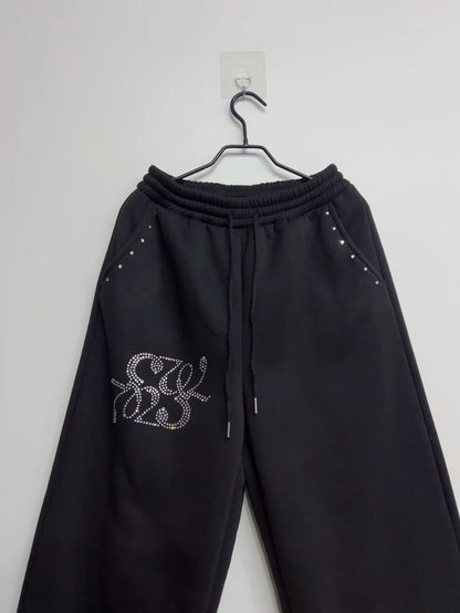 Schwarze weite Freizeithose für Damen mit Strass-Details und Kordelzug