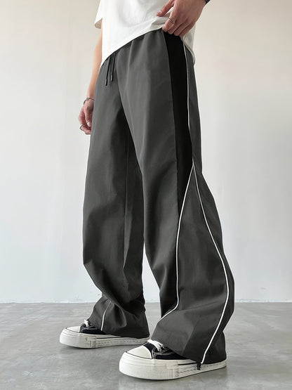 Herren Streetwear Weite Jogginghose mit Kontraststreifen und sportlichem Look