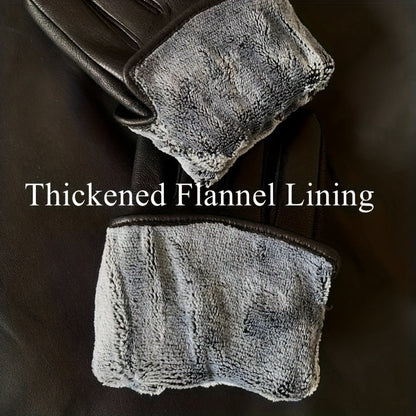 Schwarze Handschuhe aus weichem Material mit Ziernähten